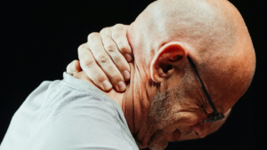 : A picture of a person having neck pain