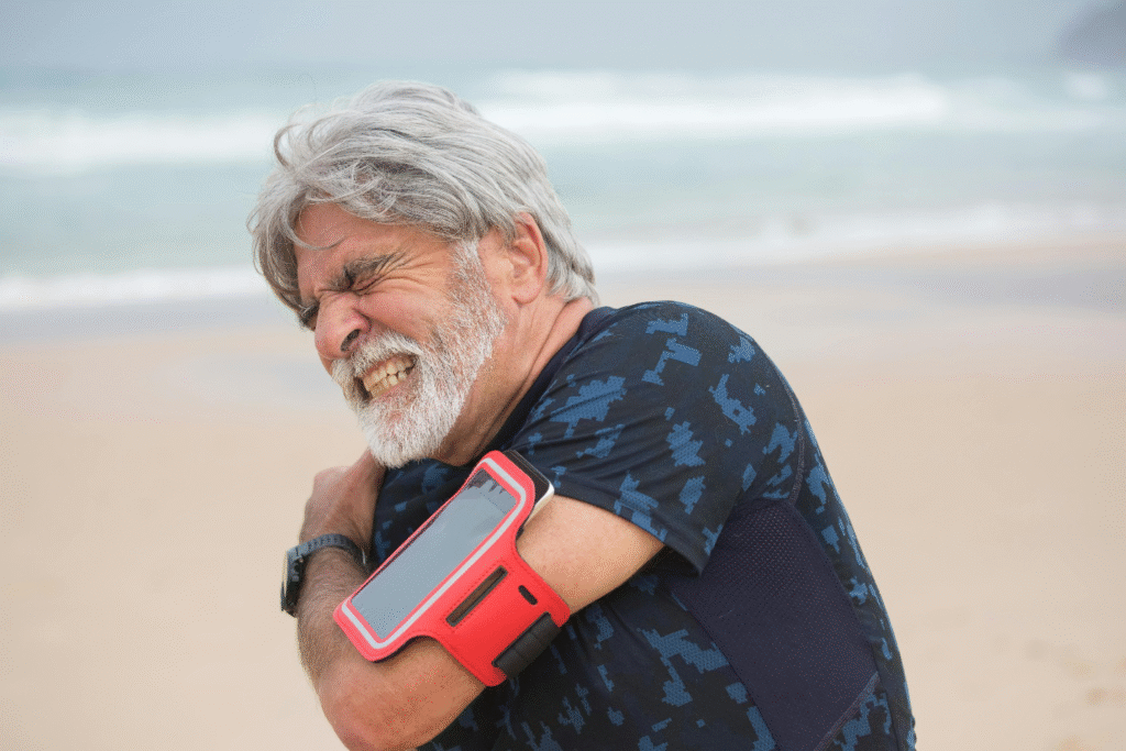 An elderly person experiencing muscle pain