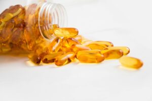 Assorted pills and tablets piled on a dark background